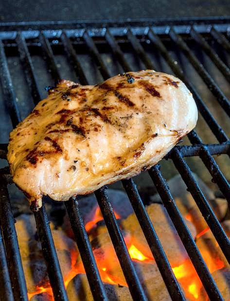 chicken breast on hot grill