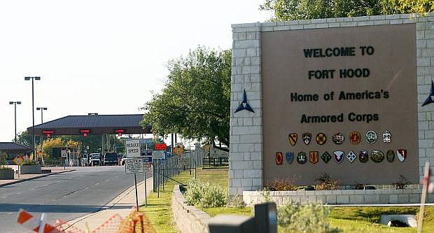FILE - In this Thursday, Nov. 5, 2009, file photo, an entrance is shown to Fort Hood Army Base in Fort Hood, Texas. Fort Hood says there&#039;s been a shooting at the Texas Army base and that there have been injuries, on Wednesday, April 2, 2014. (AP Photo/Jack Plunkett)