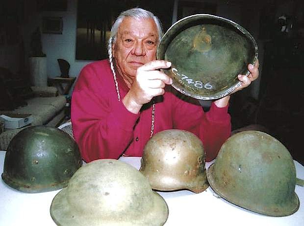 Adam Fortune Eagle, seen here holding a U.S. military helmet in this Nov. 2007 file photo, led the Native American occupation of Alcatraz Island in San Francisco Bay in 1969.