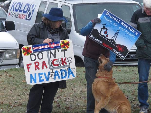 About two dozen anti-fracking protesters rally Tuesday, Dec. 9, 2014, outside the U.S. Bureau of Land Management (BLM) in Reno during the auction of oil and gas leases for energy exploration the critics say will utilize hydraulic fracturing that poses a threat to fish, wildlife and groundwater. BLM officials say all but one of the 97 parcels offered went unsold because of concerns about uncertainty about future sage grouse protection. (AP Photo/Scott Sonner)