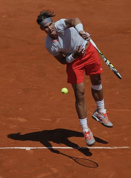 Spain&#039;s Rafael Nadal returns the ball to Serbia&#039;s Novak Djokovic during their semifinal match of the French Open tennis tournament at the Roland Garros stadium Friday, June 7, 2013 in Paris. (AP Photo/Michel Spingler)