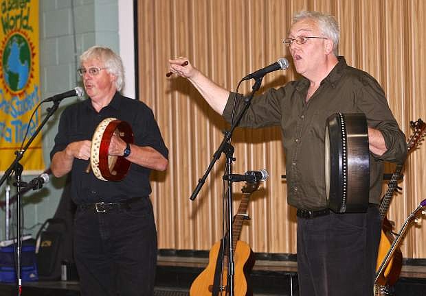 Men of Worth, Donnie Macdonald and James Keigher, sing and play Irish and Scottish folk music for the children at Fremont Elementary School Friday.