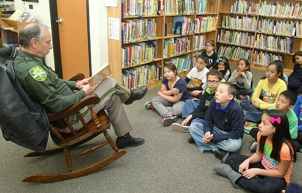 Carson City Sheriff Ken Furlong reads the book &quot;No Talking&quot; to third grade students at Bordewich Bray Elementary School on Monday morning. Monday kicked off reading week at the school.