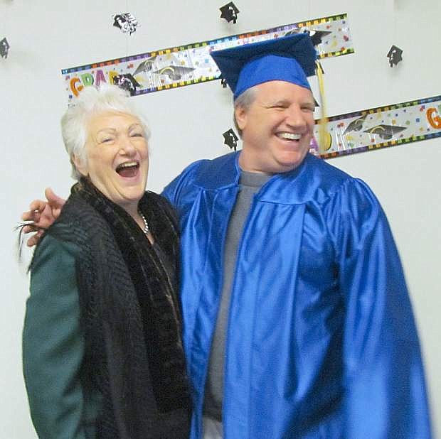 LeRoy Costa and his mother share a laugh after Fallon&#039;s GED graduation.