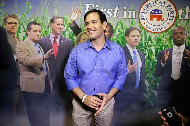 Republican presidential candidate, Sen. Marco Rubio, R-Fla., visits the Republican Party of Iowa booth during a visit to the Iowa State Fair, Tuesday, Aug. 18, 2015, in Des Moines, Iowa. (AP Photo/Charlie Neibergall)