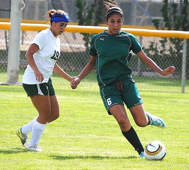 Incline&#039;s Vanessa Andrade passes the ball during Wednesday match against Fallon. Andrade netted two goals for the Highlanders in a 3-2 loss.