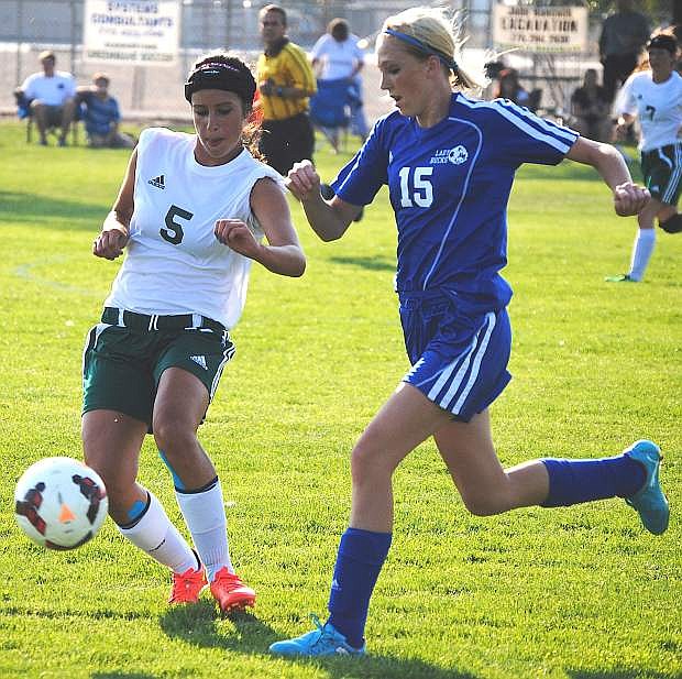 Fallon&#039;s Britney Wallace challenges a Lowry defender for the ball during the Lady Wave&#039;s 2-1 win on Tuesday at the Edward Arciniega Complex.