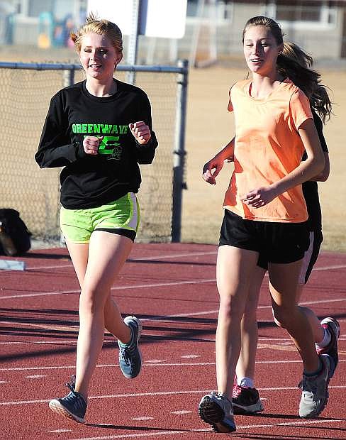Chloe Overlie, left, and Shelby Hickox give the Lady Wave a formidable presence in the distance races. Fallon begins the season Saturday at home.