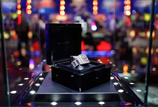 The World Series of Poker championship bracelet is seen on stage before the start of the World Series of Poker Final Table Monday, Nov. 10, 2014, in Las Vegas. (AP Photo/John Locher)