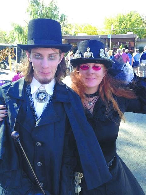 Volunteer A.J. Gonzales and Mary Bennett dressed as Madame Curry lead a recent ghost walk tour.