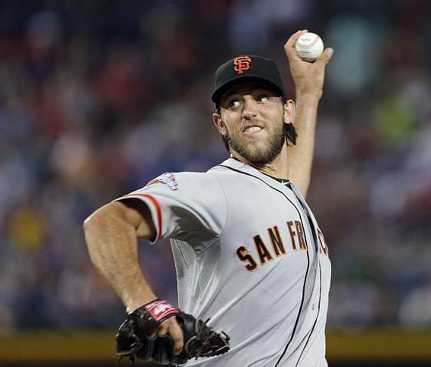 San Francisco Giants starting pitcher Madison Bumgarner works against the Atlanta Braves in the fifth inning of a baseball game on Friday, June 14, 2013 in Atlanta. (AP Photo/Joh Bazemore)