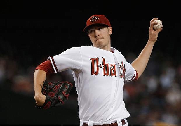 Arizona Diamondbacks&#039; Patrick Corbin throws a pitch against the San Francisco Giants during the first inning in a baseball game on Friday, June 7, 2013, in Phoenix. (AP Photo/Ross D. Franklin)
