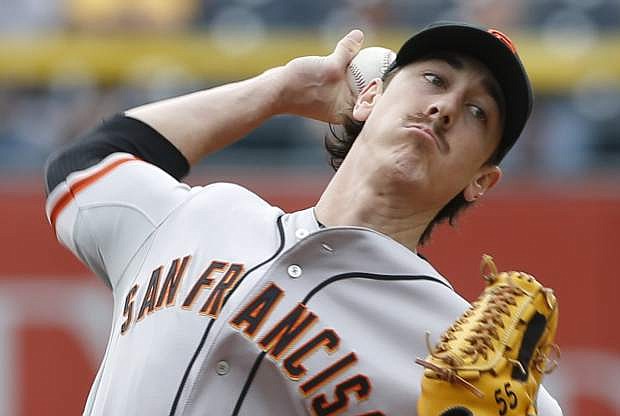 San Francisco Giants starting pitcher Tim Lincecum (55) throws against the Pittsburgh Pirates in the first inning of a baseball game on Wednesday, May 7, 2014, in Pittsburgh.  (AP Photo/Keith Srakocic)