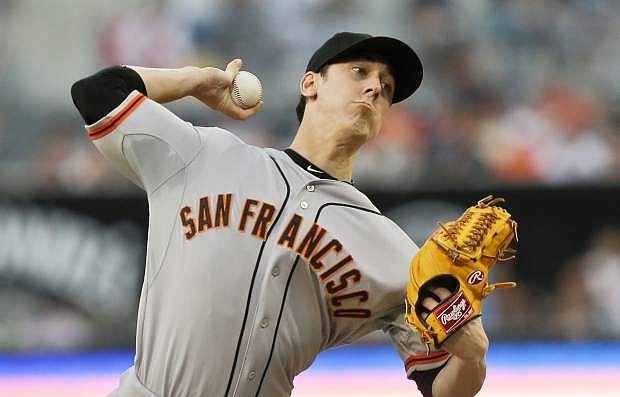 San Francisco Giants starting pitcher Tim Lincecum works against the San Diego Padres in the first inning of a baseball game in San Diego, Saturday, July 13, 2013. (AP Photo/Lenny Ignelzi)