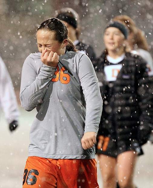 Douglas freshman Jordan Smith is emotional Monday night after the Tigers absorbed a 1-0 loss against Bishop Manogue in a snow-blown Northern Division I Region Tournament championship game at Carson High School.