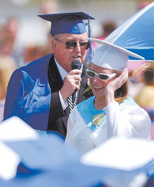 Glen Adair speaks to the 2004 Carson High graduating class after Charity Ricks and Maria Urbina presented their principal a cap and gown on his last offiical day of duty. It was his last graduation before retiring.