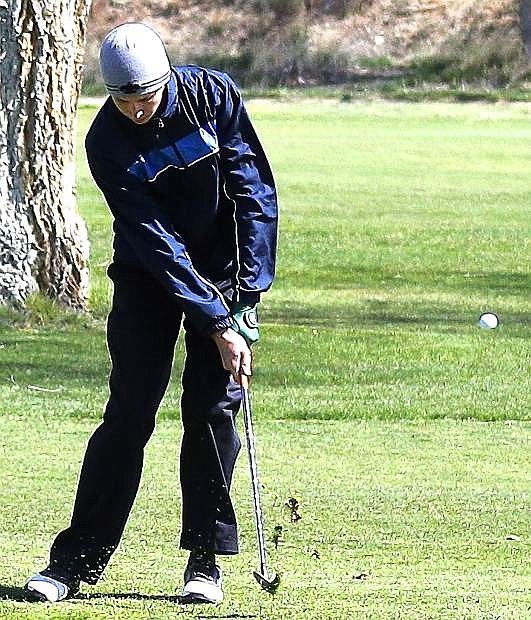 Fallon&#039;s Raymond Plasse chips onto the green during a tournament last week in Elko.