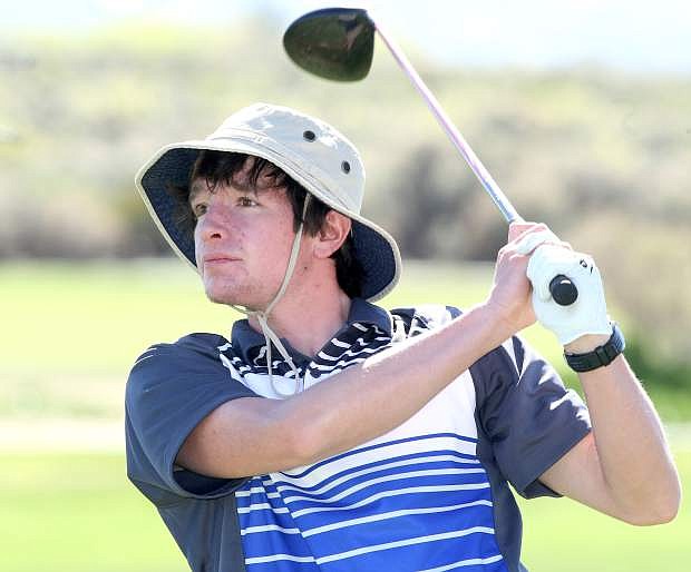 Carson High&#039;s Matt McCarthy eyes his drive from the 18th tee at Eagle Valley Golf Course on Monday.