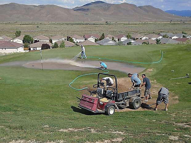 Employees of Sunridge Golf Club work on the course in this photo that was posted to the golf course&#039;s Facebook page.