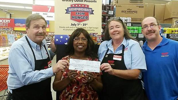 Grocery Outlet held its annual fifth annual Independence From Hunger Food Drive in July to help Dayton Food Pantry. Grocery Outlet customers helped raise about $1,500 worth of groceries and $1,387 in cash. Shown from the left are David Cox of Grocery Outlet; Freida Carbery of Dayton Food Pantry; Lynne Cox of Grocery Outlet; and Clyde Shepherd of Grocery Outlet.