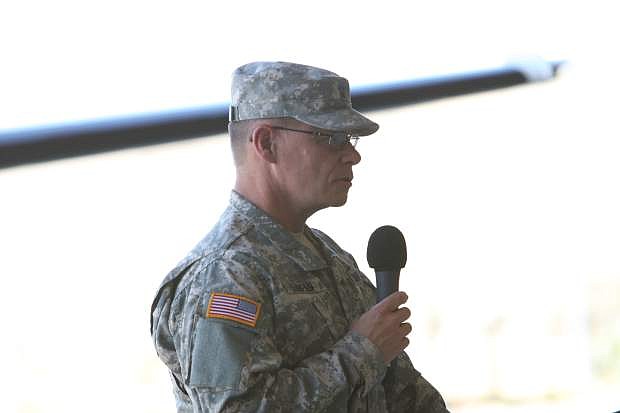 Brig. General Michael Hanifan addresses the crowd and troops at Reno-Stead airport on Wednesday.