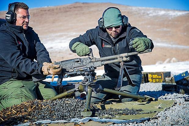 Dan Fassler and Chris Gonzales test fire U.S. Ordnance&#039;s new M240 medium machine gune at the company&#039;s firing range.