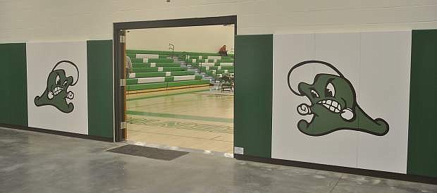 The doors leading from the wrestling room back to the main gum feature the Greenwave mascot on either side.