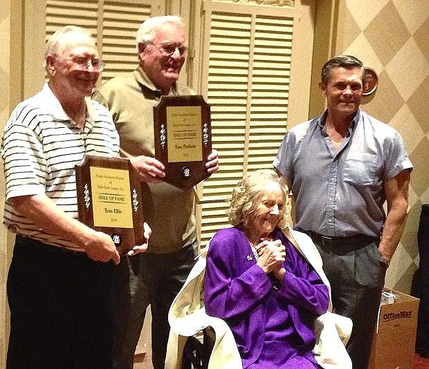 Tom Ellis, left, and Sam Paulson, second from left, receive their Hall of Fame plaques from Julia Ruth Stevens, second from right, Babe Ruth&#039;s daughter, and Tom Stevens, Babe Ruth&#039;s grandson.