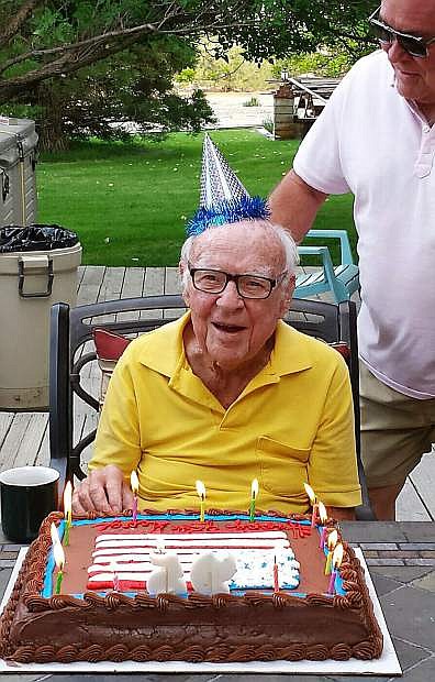 George Hampson gets ready to blow out the candles on his 95th birthday cake.