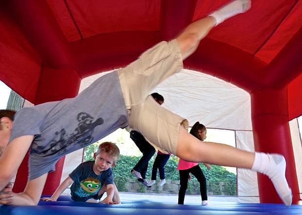 Children enjoy the Salvation Army&#039;s bounce house at the Carson City Hand Up Resource Fair Saturday in Fuji Park.
