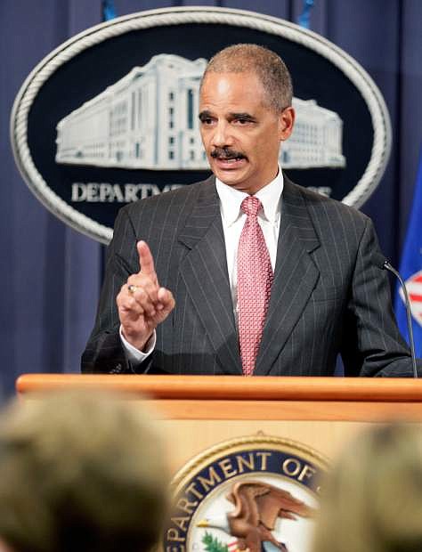 This Oct. 4, 2010 file photo shows Attorney General Eric Holder speaking during a news conference at the Justice Department  in Washington. Holder is calling for major changes to the nation&#039;s criminal justice system that would scale back the use of harsh prison sentences for certain drug-related crimes, divert people convicted of low-level offenses to drug treatment and community service programs and expand a prison program to allow for release of some elderly, non-violent offenders. (AP Photo/Carolyn Kaster, File)