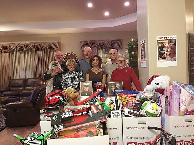 The Hartman family hosted its 10th annual open house Dec. 5 to benefit the Marine Corps Reserve Toys for Tots campaign. Through the generosity of attendees, a truckload of toys and a cash contribution will be donated.