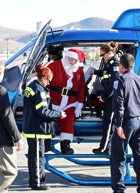 Santa Claus arrives at Walmart via CareFlight Wednesday morning for &#039;Holiday With A Hero&#039; in Carson City.
