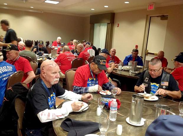 Carson City&#039;s Ken Beaton is currently on an honor flight with other veterans from Northern Nevada. He sent this photos from Friday at the group left from Reno and arrived in Baltimore Roy Evans of Carson City is picture on the left side of the table. All the males wearing red shirts are veterans, guests of Honor Flight Nevada. All the people in black shirts are volunteers serving the veterans.