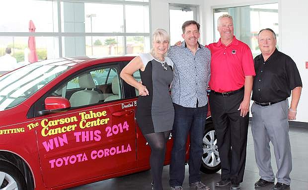Jeannette Bonaldi and her husband Paul, were the winners of the Carson Auto Group car, a 2014 Toyota Corolla, donation to Hopefest. From left, Jeanette, Paul, Dana Whaley, General Manager of Dick Campagni&#039;s Carson City Toyota, and Tim Milligan, General Manager of Dick Campagni&#039;s Capital Ford.