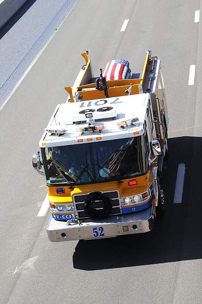 A firetruck carrying the casket of Carson City Sheriff&#039;s Deputy Carl Howell travels through Washoe Valley Thursday morning.