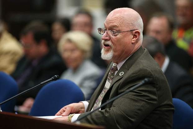 FILE - In this Wednesday, March 25, 2015 file photo, Nevada Assemblyman Randy Kirner, R-Reno, testifies on his proposal to dramatically change collective-bargaining rules for public employee unions in a hearing at the Legislative Building in Carson City, Nev. A money committee is reviewing a bill that would dramatically change the Nevada Public Employees&#039; Retirement System.  The Assembly Ways and Means Committee held a meeting Wednesday, April 15, 2015 to discuss AB190, which raised many questions and concerns at a hearing in a separate committee last month.    (AP Photo/Cathleen Allison)