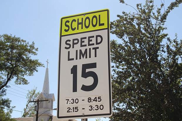 A school zone speed limit sign is shown near Bordewich-Bray Elementary School in Carson City.