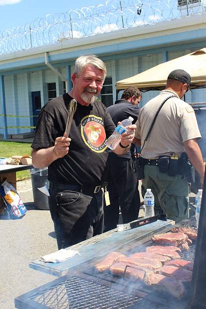 Kevin Burns, Veterans Resource Director at Western Nevada College, helps with a fundraising barbecue for inmates in May at the Nevada Department of Corrections; Warm Springs Correctional Center in Carson City.