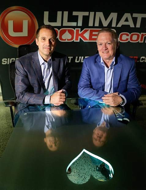 Ultimate Gaming chairman Tom Breitling, left, and CEO Tobin Prior sit for a photo at their company headquarters, Monday, April 29, 2013, in Las Vegas. The social gaming company is expected to launch the first legal, real-money poker site in the U.S. Tuesday morning. The Ultimate Gaming site will be available only to in players in Nevada, but likely represents the shape of things to come for gamblers across the country. (AP Photo/Julie Jacobson)