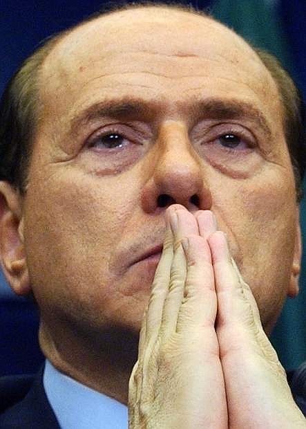 FILE -- This Saturday, Dec. 13, 2003 photo shows the then Italian Premier Silvio Berlusconi attending the final press conference at the end of a two-day EU Commission meeting at the EU Council headquarters in Brussels. The Italian Senate has begun, Wednesday, Nov. 27, 2013, debating whether to kick Silvio Berlusconi out of Parliament following his tax fraud conviction. The vote is scheduled later in the day and most analysts expect he will lose his seat. Berlusconi fans massed in front of his Rome palazzo for a planned rally that analysts say is essentially the start of Italy&#039;s next electoral campaign. (AP Photo/Domenico Stinellis)