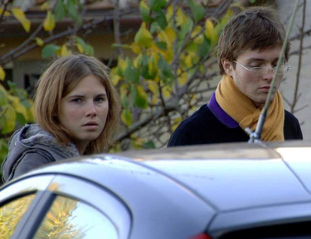 FILE - In this Friday Nov. 2, 2007 file photo Amanda Marie Knox, left, and Raffaele Sollecito, stand outside the rented house where 21-year-old British student Meredith Kercher was found dead Friday, in Perugia, Italy. The state&#039;s prosecutor is arguing his case that an appeals court should reinstate the guilty verdict against U.S. exchange student Amanda Knox for the grisly 2007 murder of her roommate. Prosecutor Alessandro Crini said Monday that Italy&#039;s highest court had &quot;razed to the ground&quot; the Perugia appellate court&#039;s 2011 decision to throw out the guilty verdicts, freeing Knox and co-defendant Raffaele Sollecito. (AP Photo/Stefano Medici)