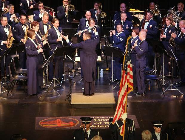 The U.S. Air Force of the Golden West Band performs the National Anthem to start their concert at the community center on Tuesday night.