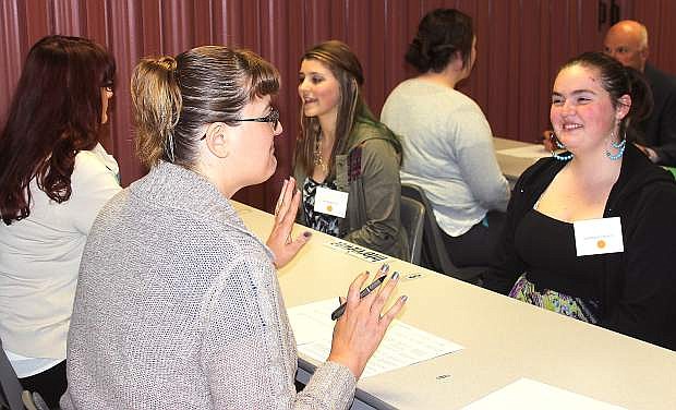 Students from Churchill County High School participated in a mock interview during a job fair co-sponsored by Western Nevada College Fallon, Churchill Economic Development Authority and CCHS. Students Dominique Esposito, right, and Katherine Felte speak with interviews.