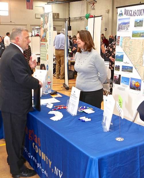 Douglas County recruiter Cindy McMurry speaks with unemployed veteran Al Reshaw of Minden Friday at the community center. The event was co-sponsored by the Carson City Chamber of Commerce and Carson City Health and Human Services. 39 employers and 17 resources were present for job seekers to speak with.