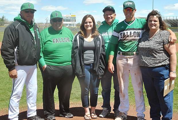From left: Coach Lester de Braga, assistant coach Dave Munoz,  Kaitlyn Johnson (Kendall&#039;s sister), Boyd Johnson (Kendall&#039;s father) Kendall Johnson and Tina Johnson (Kendall&#039;s mother) stand for a photo on the Greenwave baseball diamond&#039;s mound.