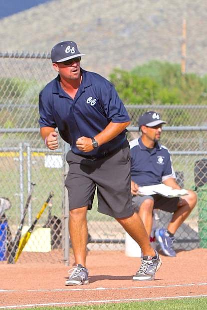 Coach Joe Tierney gives a runner at first a signal Friday afternoon during a game against South Tahoe.