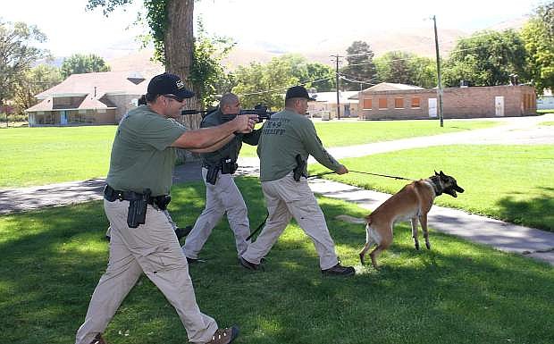 Carson City Sheriff&#039;s Office K9 and SWAT officers prepare to infultrate a building to look for a barricaded suspect during a training held Wednesday afternoon.