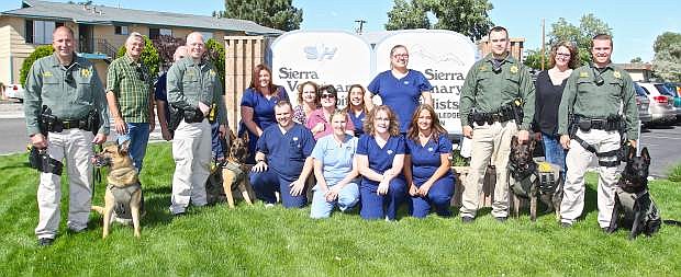 CCSO K9 officers pose with the staff of Sierra Veterinary Hospital Wednesday in Carson City.