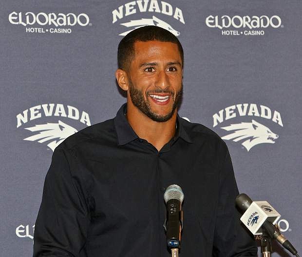 San Francisco 49ers quarterback Colin Kaepernick laughs during the press conference at the Governor&#039;s Mansion Friday evening .Kaepernick was in Carson City for the University of Nevada&#039;s Governor&#039;s Dinner fundraiser.